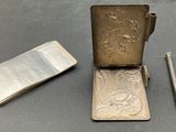a small metal case with a pen and a small metal case