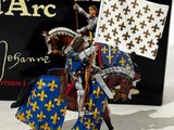 statue of a man on a horse with a flag in front of a box