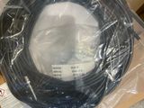 a black cable wrapped in plastic on top of a box