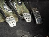 two pedals that are sitting on the floor of a car