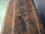 a wooden table that is sitting on the floor