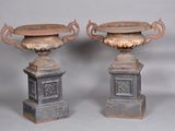 two vases sitting on top of each other on a table