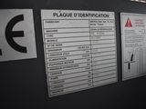 signs on the wall of a building indicating the location of the place of identification