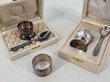 two silverware items in a wooden box on a table
