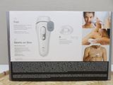 an image of a box with a picture of a woman getting her skin done