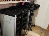 many bins and containers on the shelves in the room