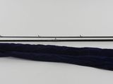 a fishing rod and a fishing pole on a white surface