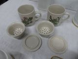 a white table with cups and saucers on it