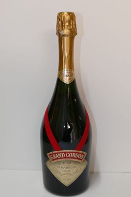 the bottle of champagne is sitting on the table ready to be filled