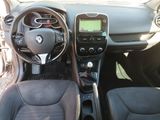 the interior of a car with a steering wheel and dashboard controls