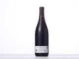 a bottle of wine that is sitting on a table