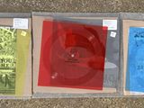 three cds in a plastic case on the floor
