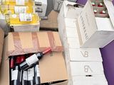 many boxes of wine sitting on the floor next to each other