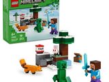 the lego minecraft set is in a box with a cat and a dog