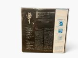 a box with a picture of a man in a suit on it
