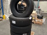 two tires stacked on top of each other in a warehouse