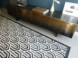 a black and white rug on the floor in a room