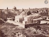 an old photo of a view of a city from the top of a hill