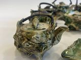 three teapots that are sitting next to each other