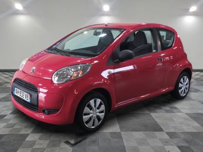 a picture of a red car parked in a garage