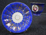 blue and gold china cup and saucer