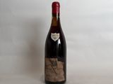 a bottle of wine that is sitting on a table