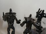 three figurines that are sitting on a table