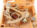 a wooden box with a brass sexet inside of it