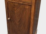 an image of a small wooden cabinet with a drawer