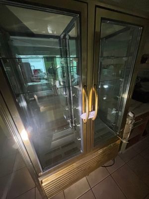 a glass door with a handle in the middle of the room