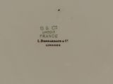 a close up of a white plate with black writing on it