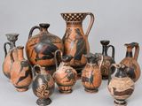 many vases that are sitting on a table
