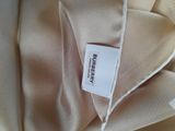 an image of a close up of a shirt with a label on it