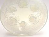 a glass vase with white flowers inside of it