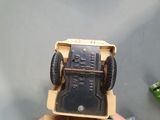 a toy truck that is sitting on top of a cardboard box
