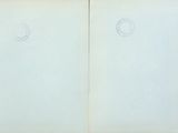 an open book with a drawing of a circle on the front of it