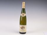 a bottle of wine that is sitting on a table
