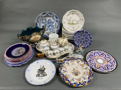 many plates and bowls that are sitting on a table