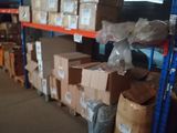 boxes are stacked on a shelf in a warehouse with a lot of boxes