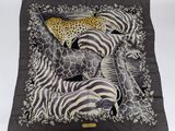 zebras, giraffes, and leopards on a black and white scarf