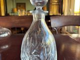 a glass decanter on a table in a dining room