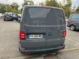 a grey van that is parked in a parking lot