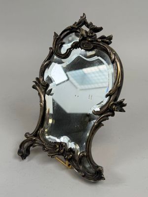 a mirror that is sitting on top of a table