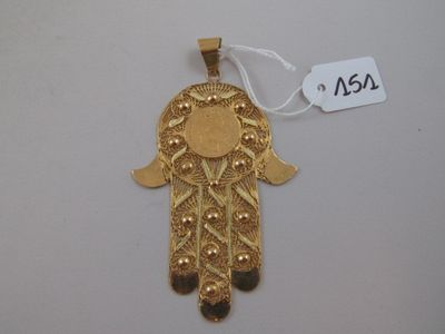 an image of a gold hametle hanging on a white wall