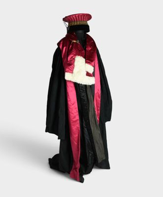 costume of a man in a red and black robe and hat