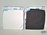pair of white and black underwear sitting on top of a white table