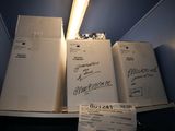 three refrigerators stacked on top of each other in a room