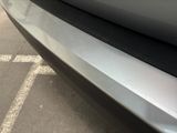 a close up of a car ' s bumper with a sticker on it