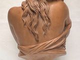 an image of a bust of a woman with long hair