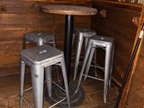 two stools and a table in a room